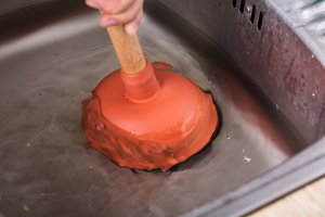 rubber plunger sink drain unblock